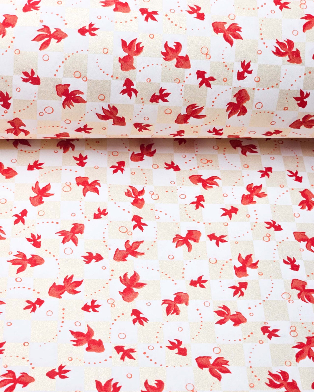 Japanese chiyogami paper featuring red koi fishes on a white and pearlescent beige ichimatsu (checker) background.