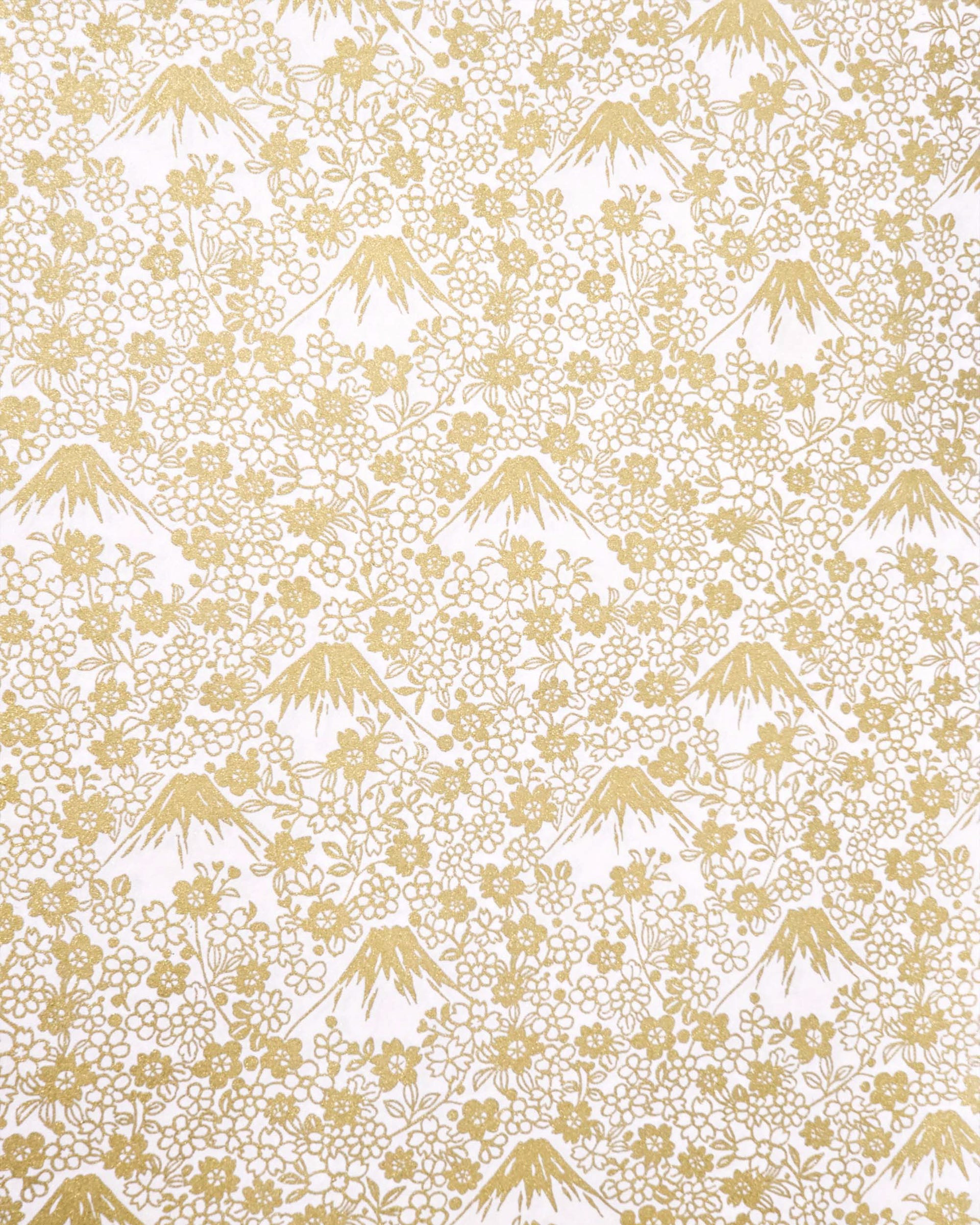 Japanese chiyogami paper featuring metallic gold Mt. Fujis and cherry blossoms on a light pink background.