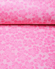 Japanese chiyogami paper featuring a pointillistic cherry blossom design on a pink background.