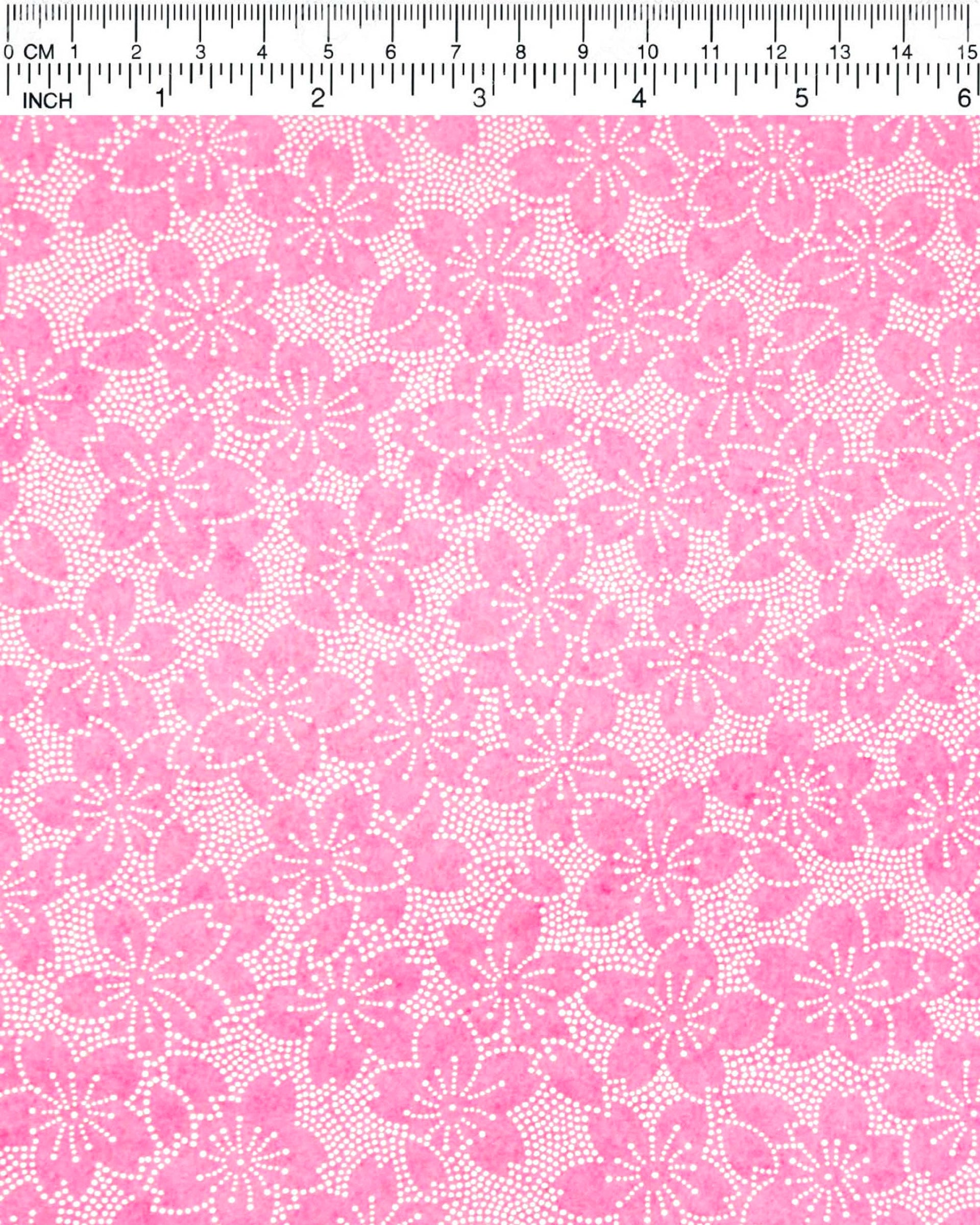 Japanese chiyogami paper featuring a pointillistic cherry blossom design on a pink background.