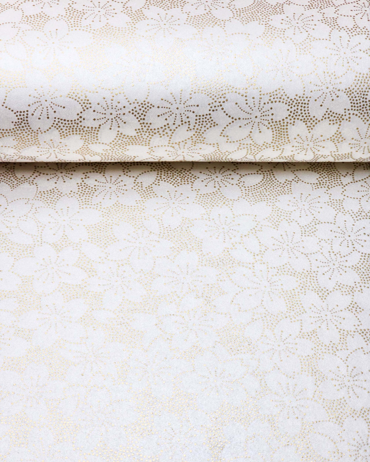 Japanese chiyogami paper featuring a metallic gold pointillistic cherry blossom design on a white background.