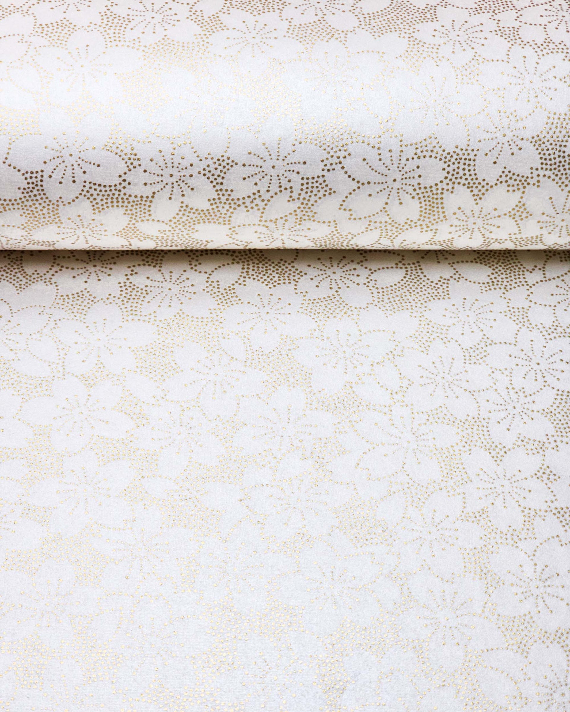 Japanese chiyogami paper featuring a metallic gold pointillistic cherry blossom design on a white background.