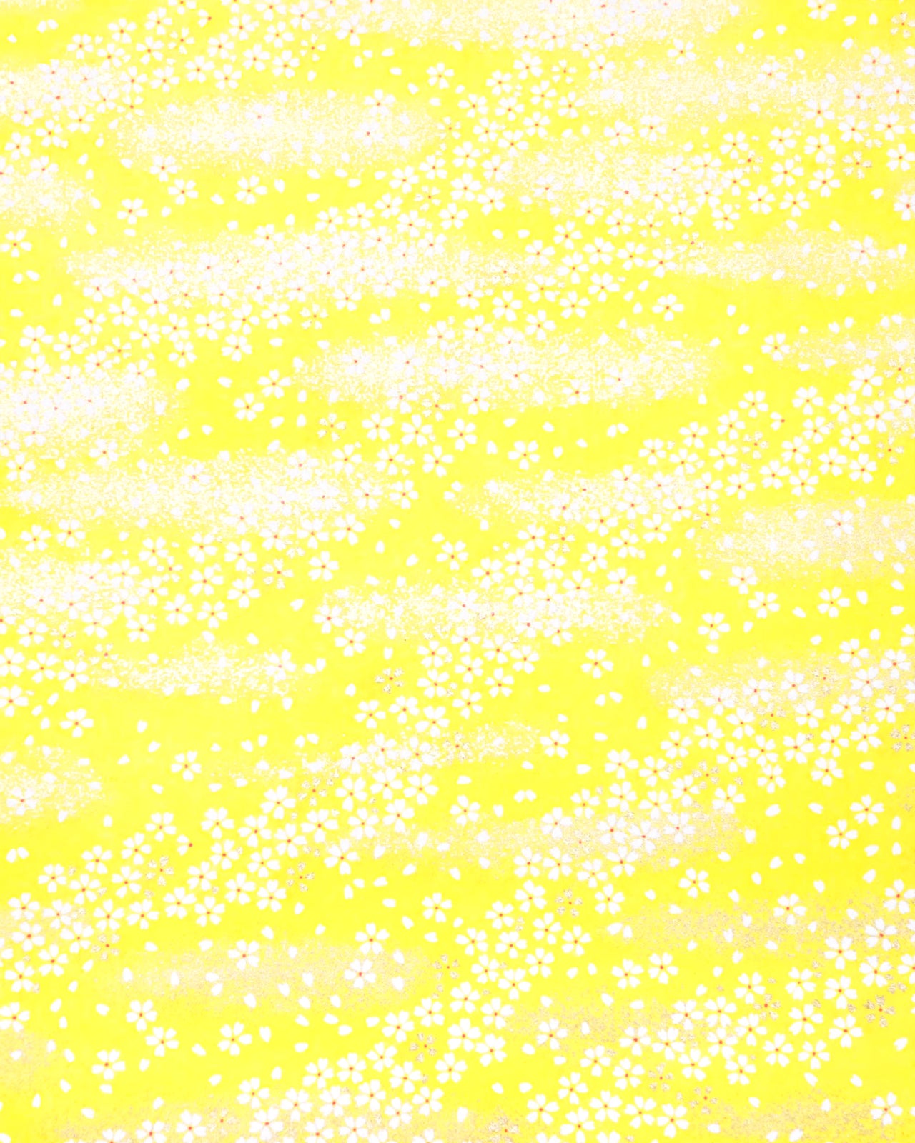 Japanese chiyogami paper featuring small metallic gold and white cherry blossoms on a yellow background.