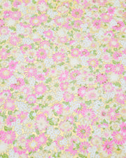 Japanese chiyogami paper featuring textured white and pink mum flowers on a metallic gold background. The lines on the flowers are raised.