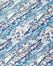 Japanese chiyogami paper featuring an assortment of blue and white traditional Japanese flowers and leaves on a blue and white gradient background with metallic gold details.