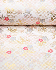 Japanese chiyogami paper featuring light pink, fuchsia, and metallic silver cherry blossoms on a pink and beige ichimatsu (checkered) background with metallic gold accents.