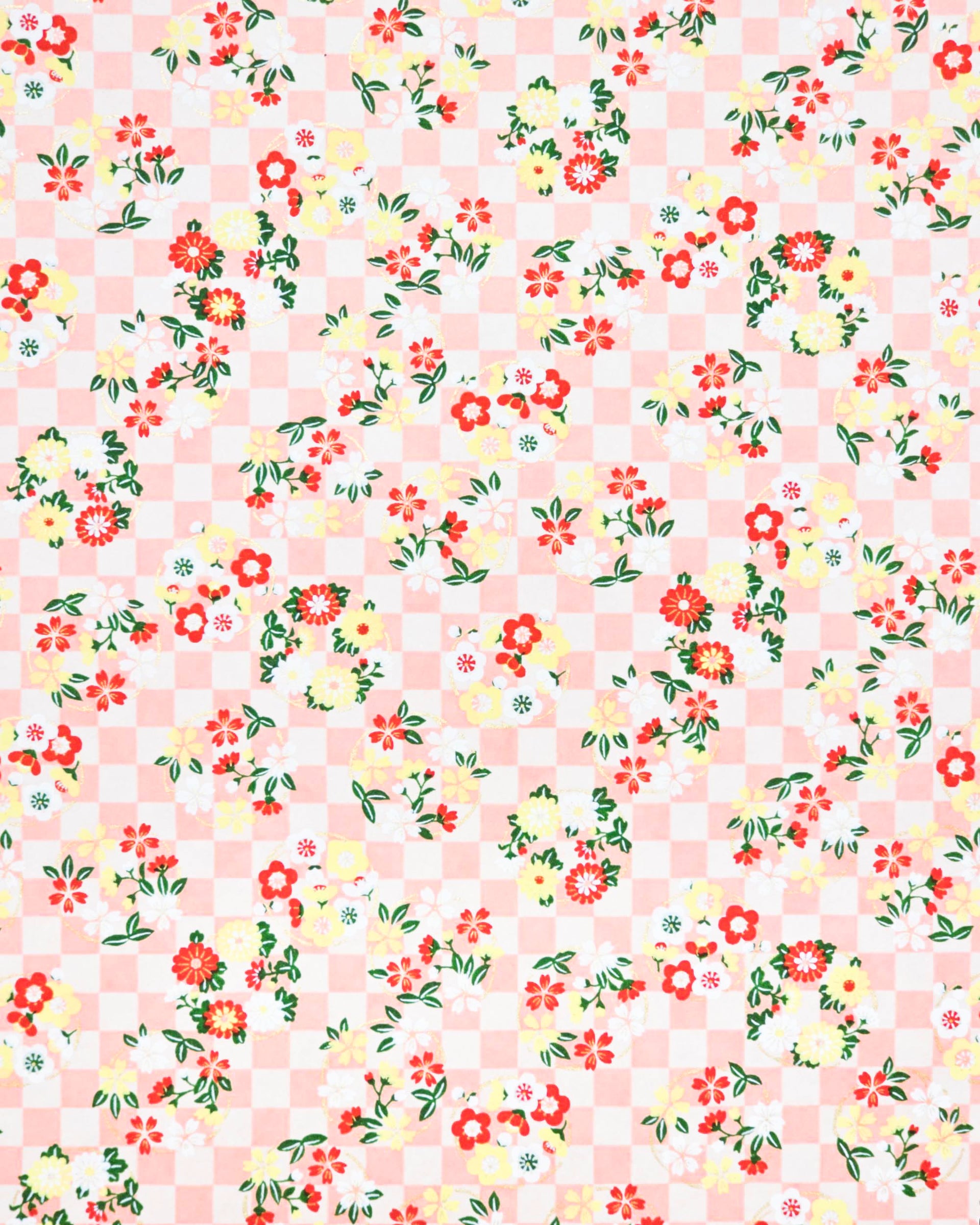 Japanese chiyogami paper featuring yellow, red, and white flowers with green leaves on a light orange ichimatsu (checkered) background with metallic gold accents.