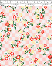 Japanese chiyogami paper featuring yellow, red, and white flowers with green leaves on a light orange ichimatsu (checkered) background with metallic gold accents.