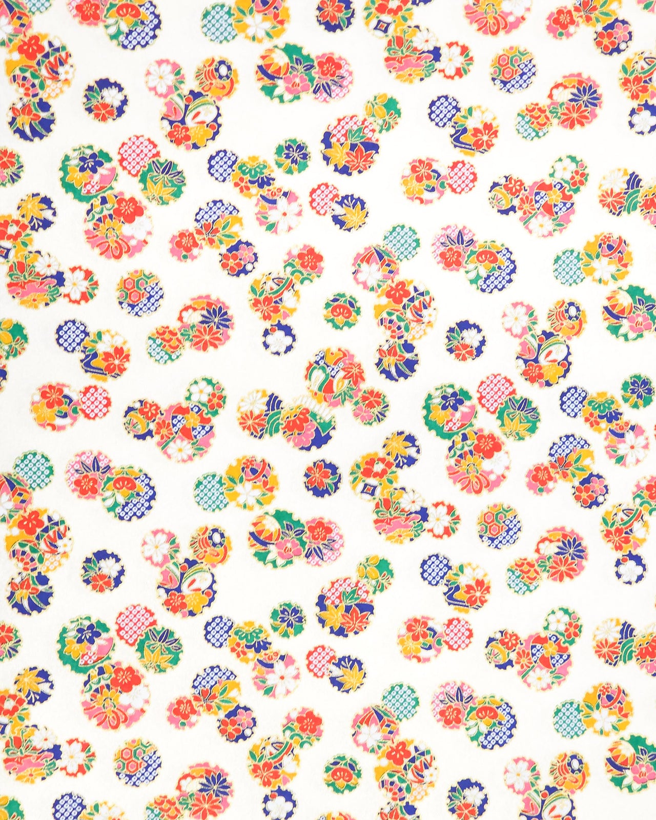 Japanese chiyogami paper featuring yukiwa (snowflake) with various floral and geometric designs on a pearlescent white background with metallic gold accents.