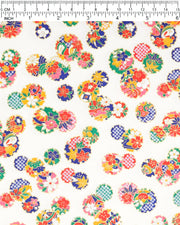 Japanese chiyogami paper featuring yukiwa (snowflake) with various floral and geometric designs on a pearlescent white background with metallic gold accents.