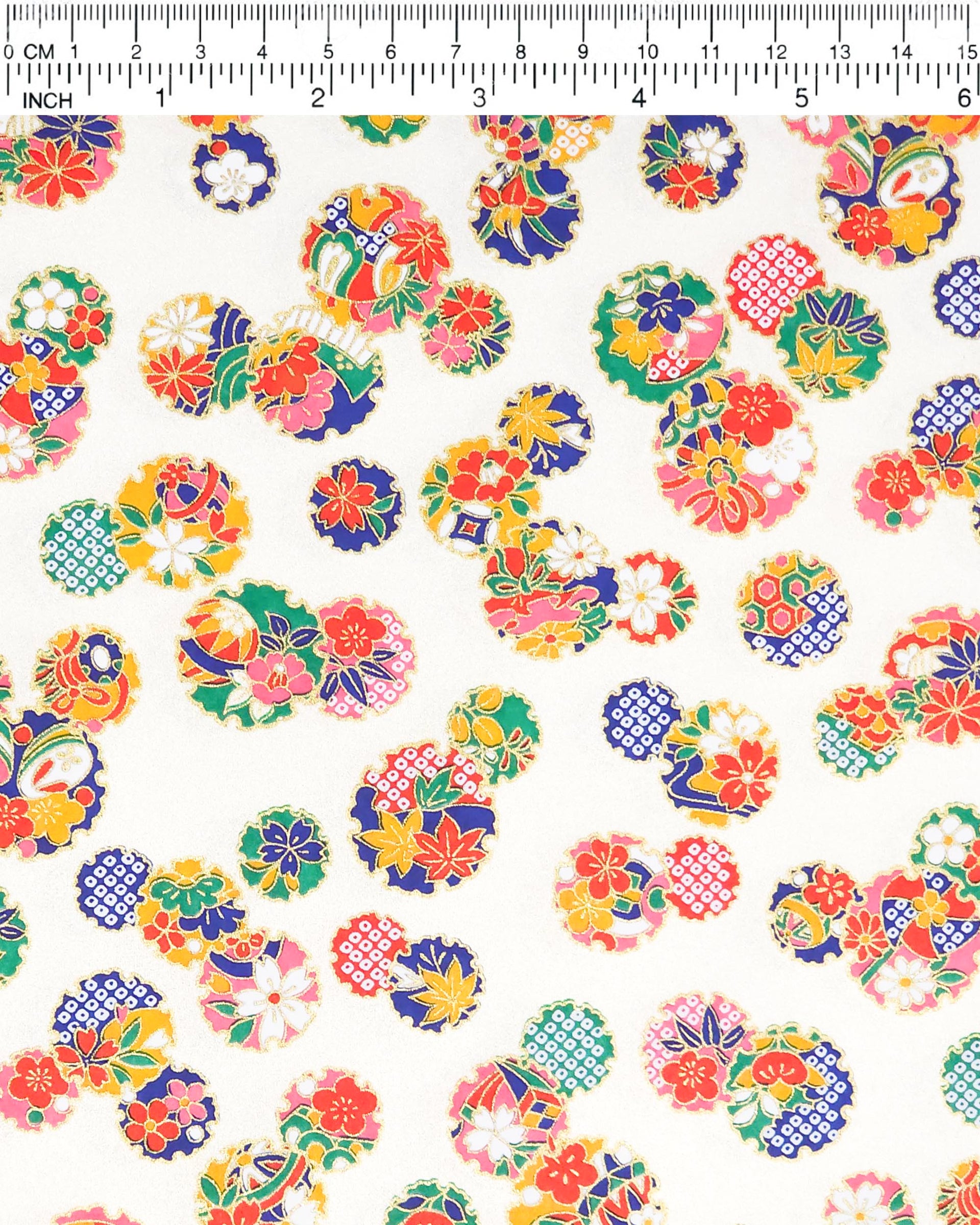 Japanese chiyogami paper featuring yukiwa (snowflake) with various floral and geometric designs on a pearlescent white background with metallic gold accents.