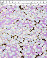 Japanese chiyogami paper featuring light blue plum blossom trees with dark brown branches on a pearlescent light purple background with metallic gold details.