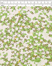 Japanese chiyogami paper featuring green and white cherry blossoms with light green branches on a green background with metallic gold accents.