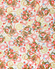 Japanese chiyogami paper featuring assorted red, light blue, and white flowers with green leaves inside red drums on a pearlescent white background with metallic gold accents. 