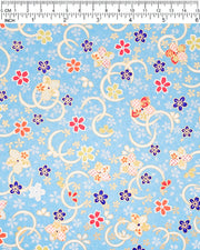 Japanese chiyogami paper featuring red, blue, green, and white plum and cherry blossoms on a sky blue background with metallic gold accents.