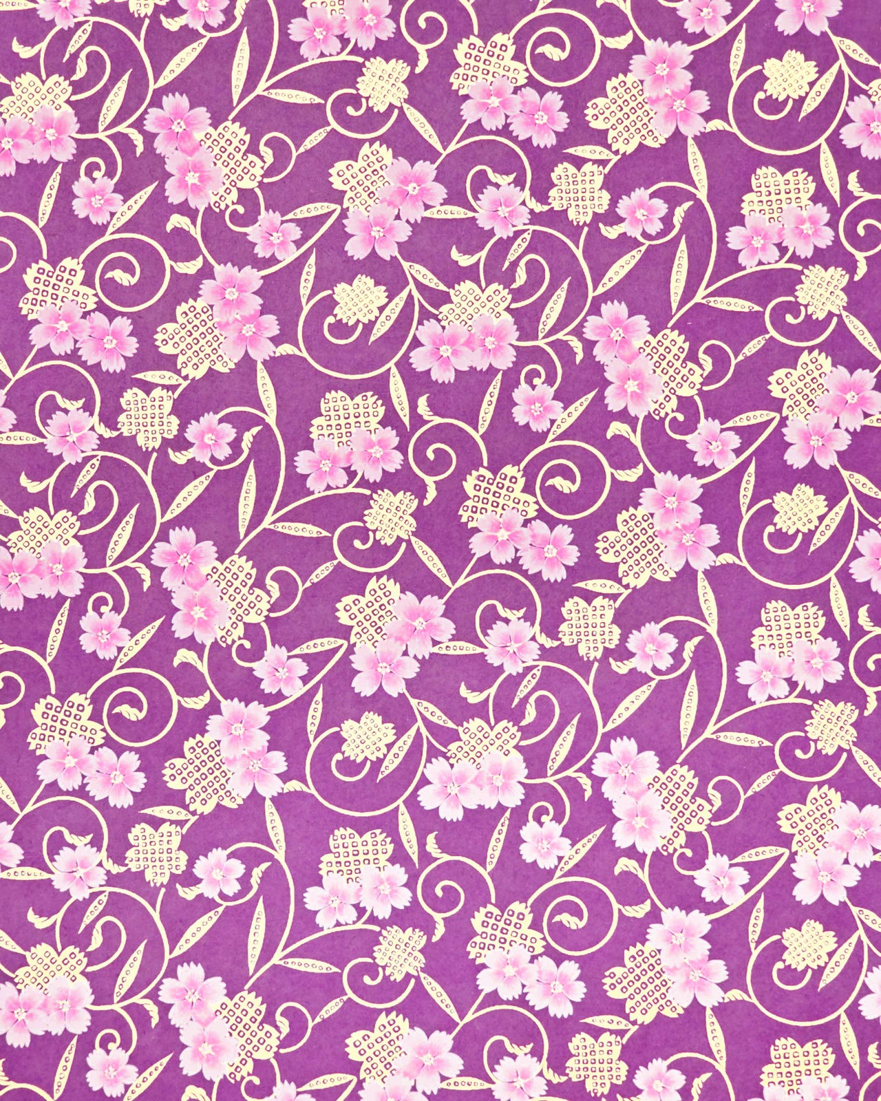 Japanese chiyogami paper featuring pink cherry blossoms alongside gold cherry blossoms and leaves decorated with a traditional kanoko (fawn) pattern on a purple background with metallic gold details.