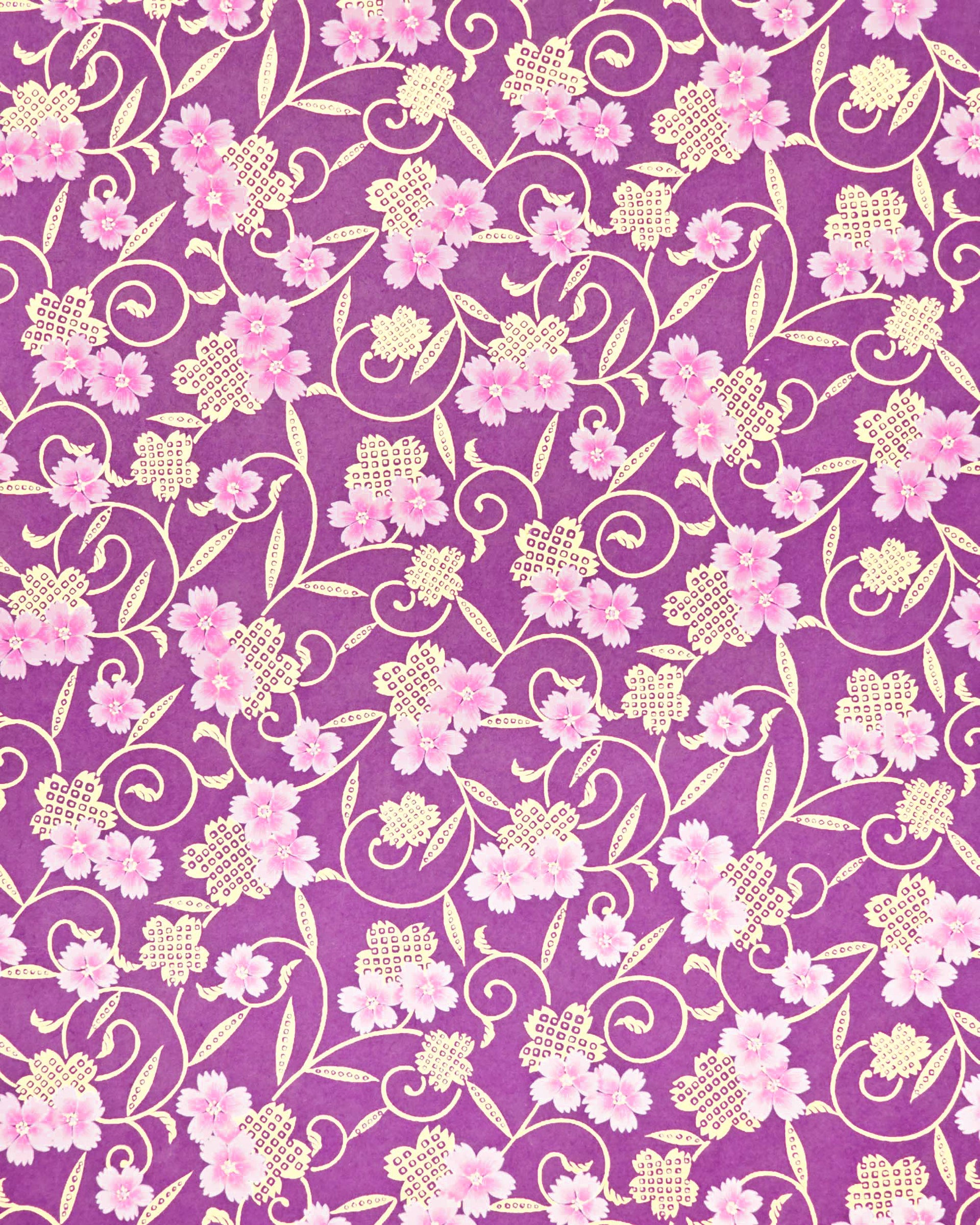Japanese chiyogami paper featuring pink cherry blossoms alongside gold cherry blossoms and leaves decorated with a traditional kanoko (fawn) pattern on a purple background with metallic gold details.