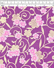 Japanese chiyogami paper featuring pink cherry blossoms alongside gold cherry blossoms and leaves decorated with a traditional kanoko (fawn) pattern on a purple background with metallic gold details, shown next to a ruler for size reference.