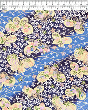 Japanese chiyogami paper featuring metallic gold butterflies with purple and pink flowers on a blue background covered with small white flowers, shown next to a ruler for size reference.