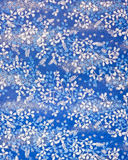Japanese chiyogami paper featuring blue and white hagi (bush clover) on a blue background with metallic gold details. 