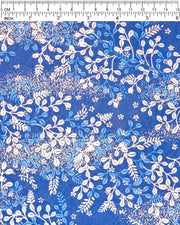 Japanese chiyogami paper featuring blue and white hagi (bush clover) on a blue background with metallic gold details, shown next to a ruler for size reference.