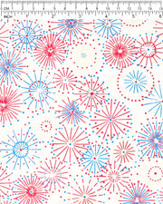 Japanese chiyogami paper featuring colorful red, blue, pink, and white exploding fireworks on a white background with metallic gold details, shown next to a ruler for size reference.