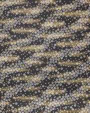 Japanese chiyogami paper featuring small white and gold cherry blossoms on a black background with metallic gold details.