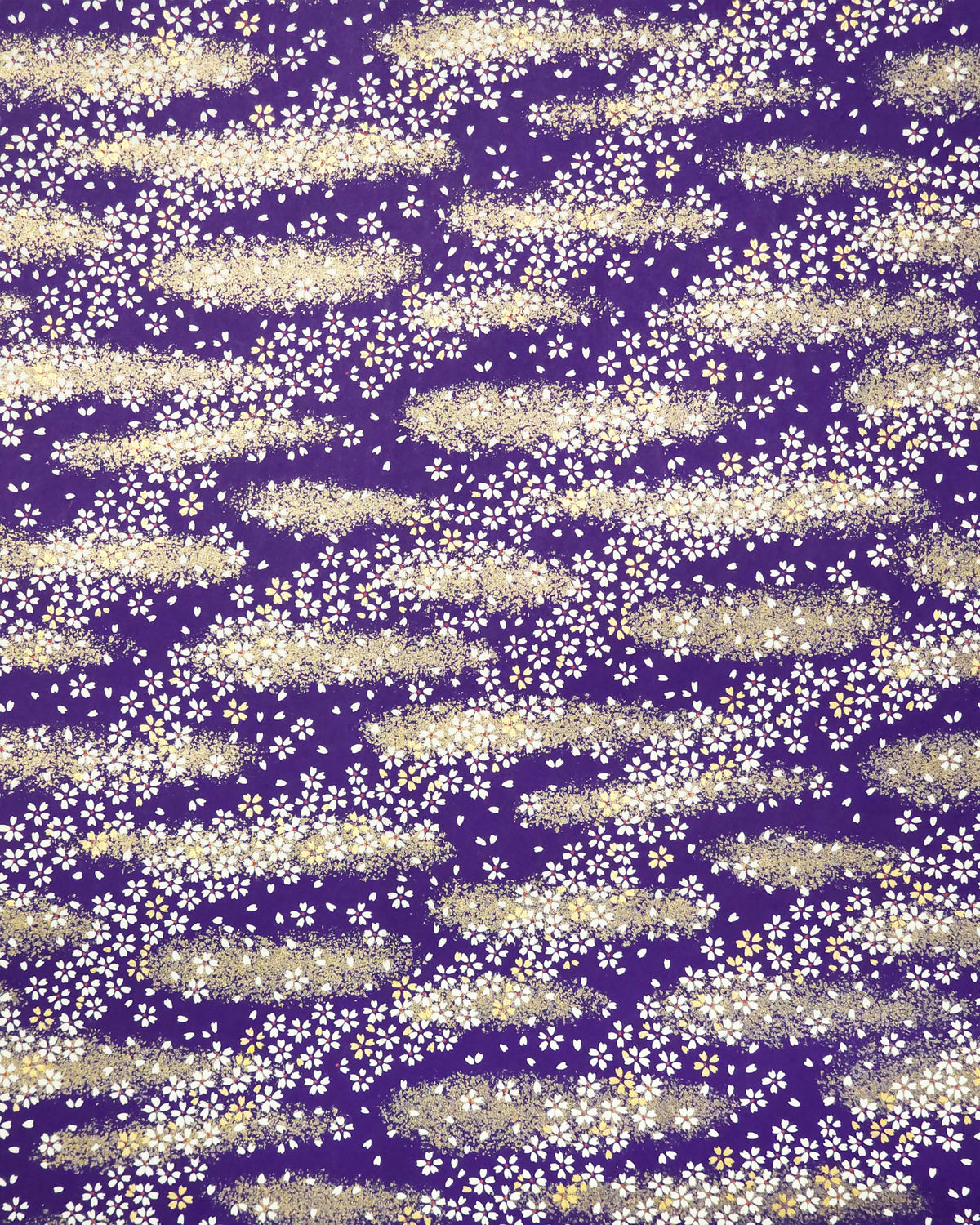 Japanese chiyogami paper featuring small white and gold cherry blossoms on a dark blue background with metallic gold details.