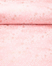 Japanese chiyogami paper featuring small white and gold cherry blossoms on a pink background with metallic gold details, shown rolled to highlight the design.