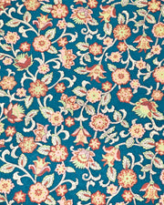 Japanese chiyogami paper featuring red and pink sarasa flowers on a dark blue background with metallic gold accents.