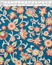 Japanese chiyogami paper featuring red, pink, and green sarasa flowers on a dark blue background with metallic gold details, shown next to a ruler for size reference.