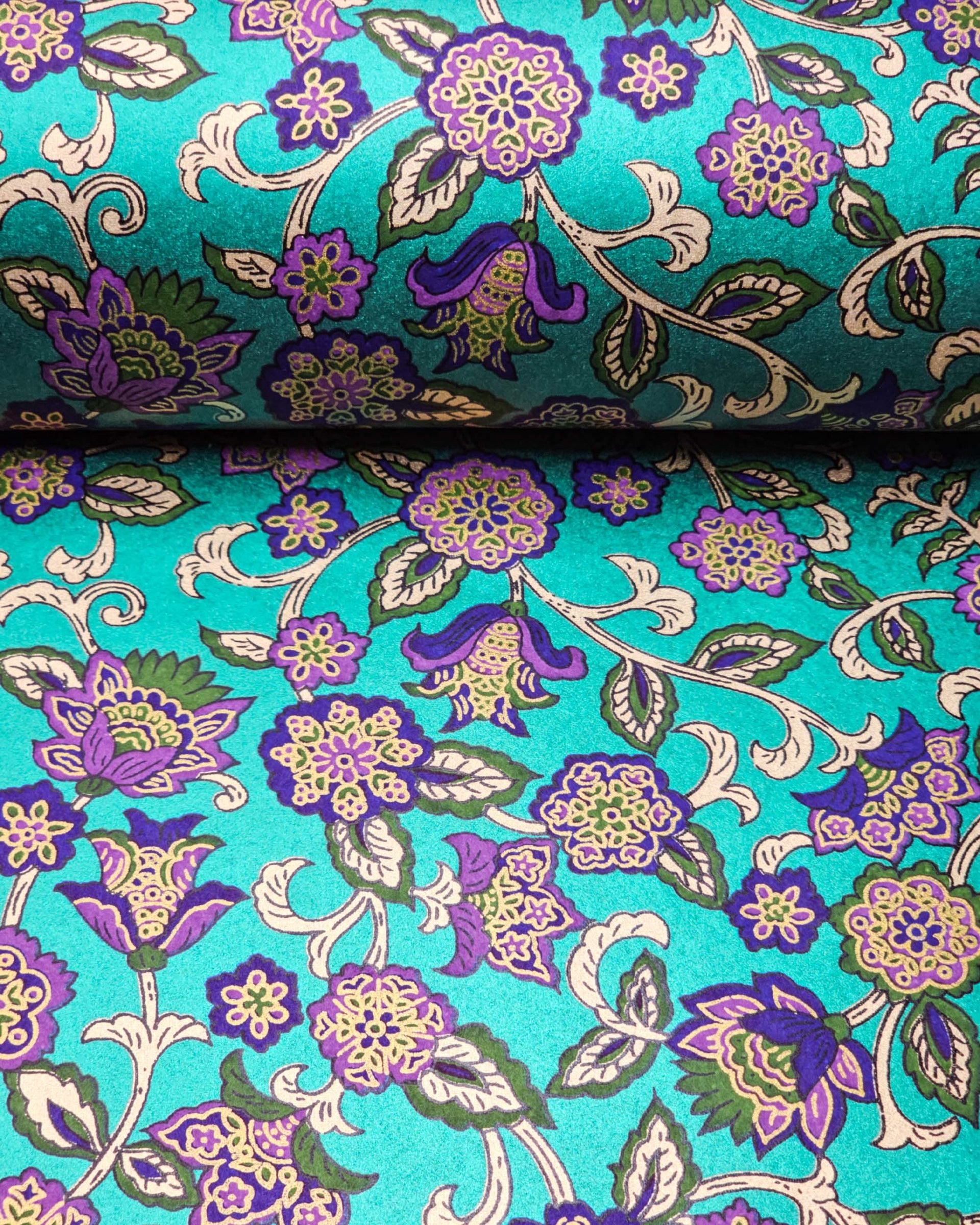 Japanese chiyogami paper featuring purple and green sarasa flowers on a pearlescent green background with metallic gold accents.