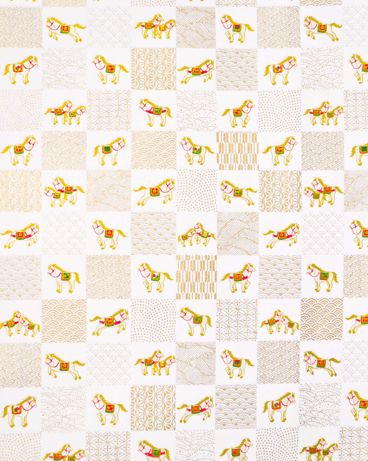 Japanese chiyogami paper featuring white horses with gold manes wearing red and green saddles and bridles, alternating with assorted metallic gold traditional Japanese patterns in an ichimatsu (checker) design on a white background.