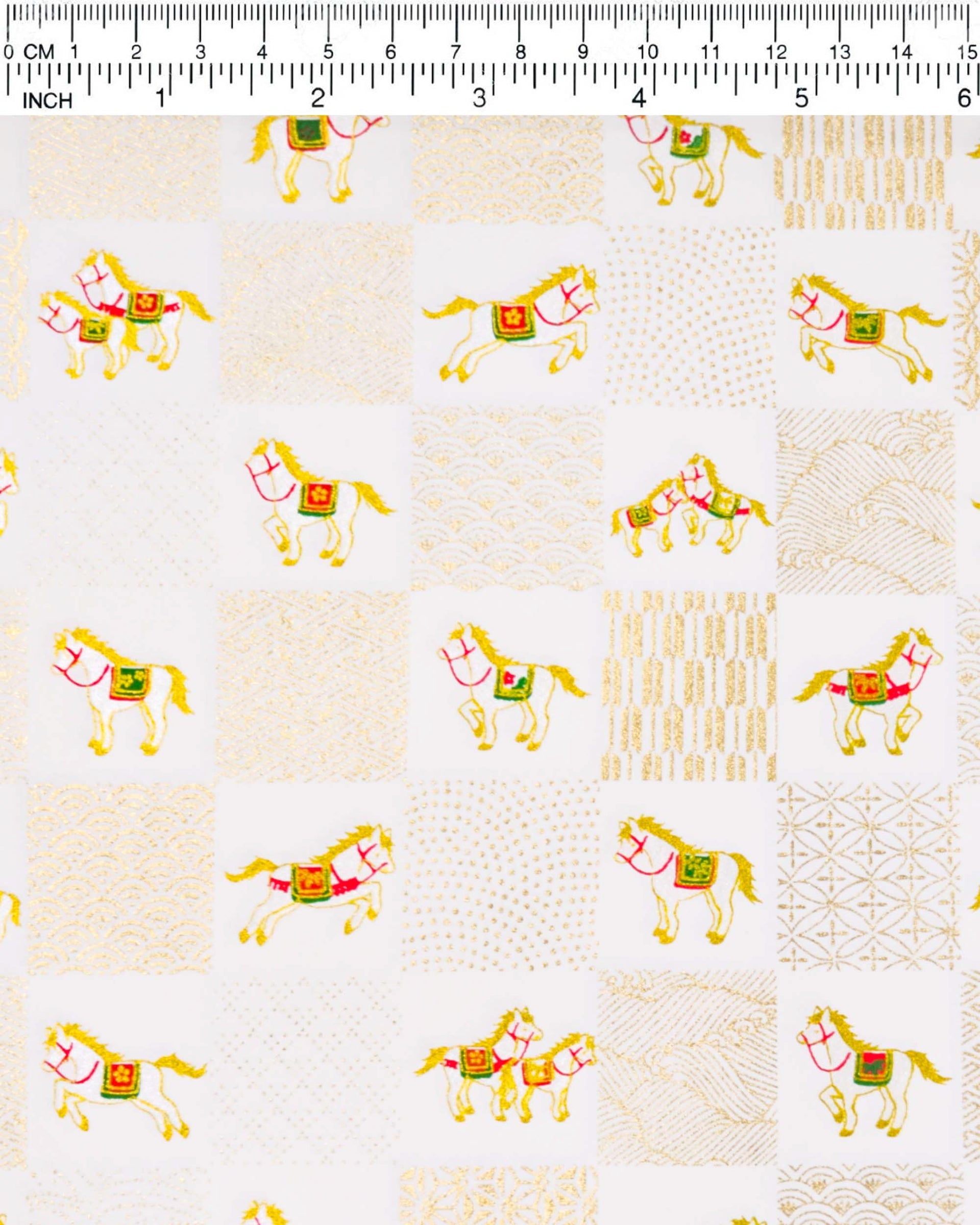 Japanese chiyogami paper featuring silver horses with red and green accents and gold assorted traditional Japanese designs in an ichimatsu (checker) design on a white background with metallic gold accents.