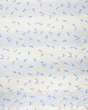 Japanese chiyogami paper featuring blue and white dragonflies on a pearlescent light blue gradient background with metallic gold wavy lines.