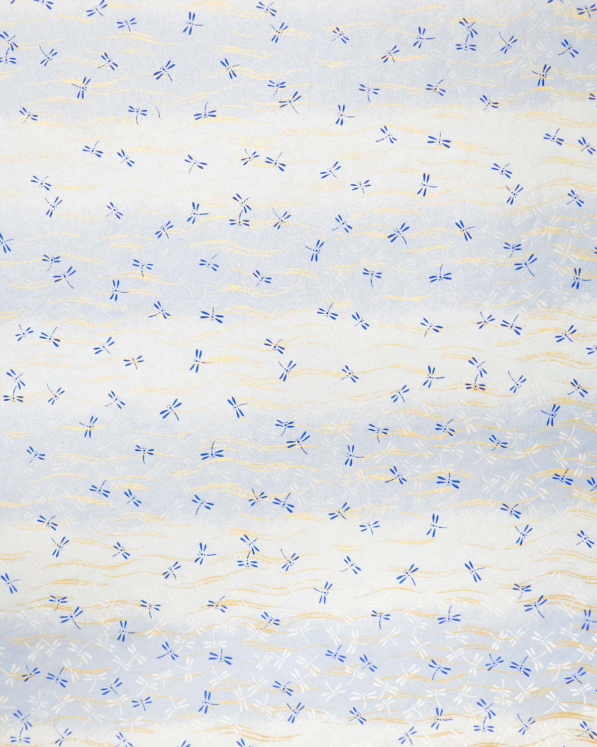 Japanese chiyogami paper featuring blue and white dragonflies on a pearlescent light blue gradient background with metallic gold wavy lines.