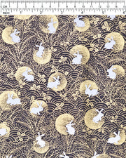 Japanese chiyogami paper featuring white rabbits with gold moons on a black background with metallic gold accents.