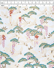 Japanese chiyogami paper featuring white flying cranes, purple and red wisteria, and green pine on a pearlescent light blue background with metallic gold details, shown next to a ruler for size reference.
