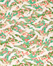 Japanese chiyogami paper featuring white flying cranes and red and white cherry blossoms among beige and green clouds and green waves with metallic gold details.