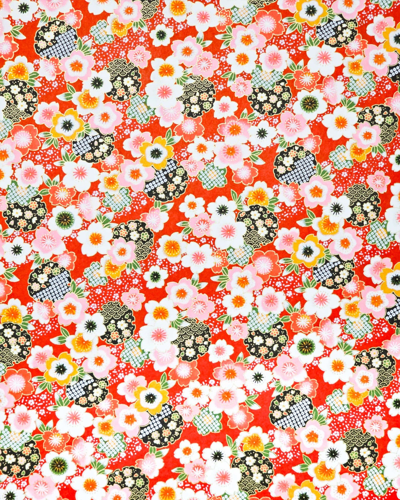 Japanese chiyogami paper featuring cranes and red cherry blossoms on a green and beige background with metallic gold accents.