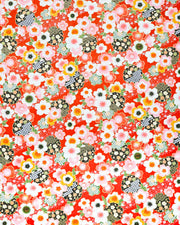 Japanese chiyogami paper featuring cranes and red cherry blossoms on a green and beige background with metallic gold accents.