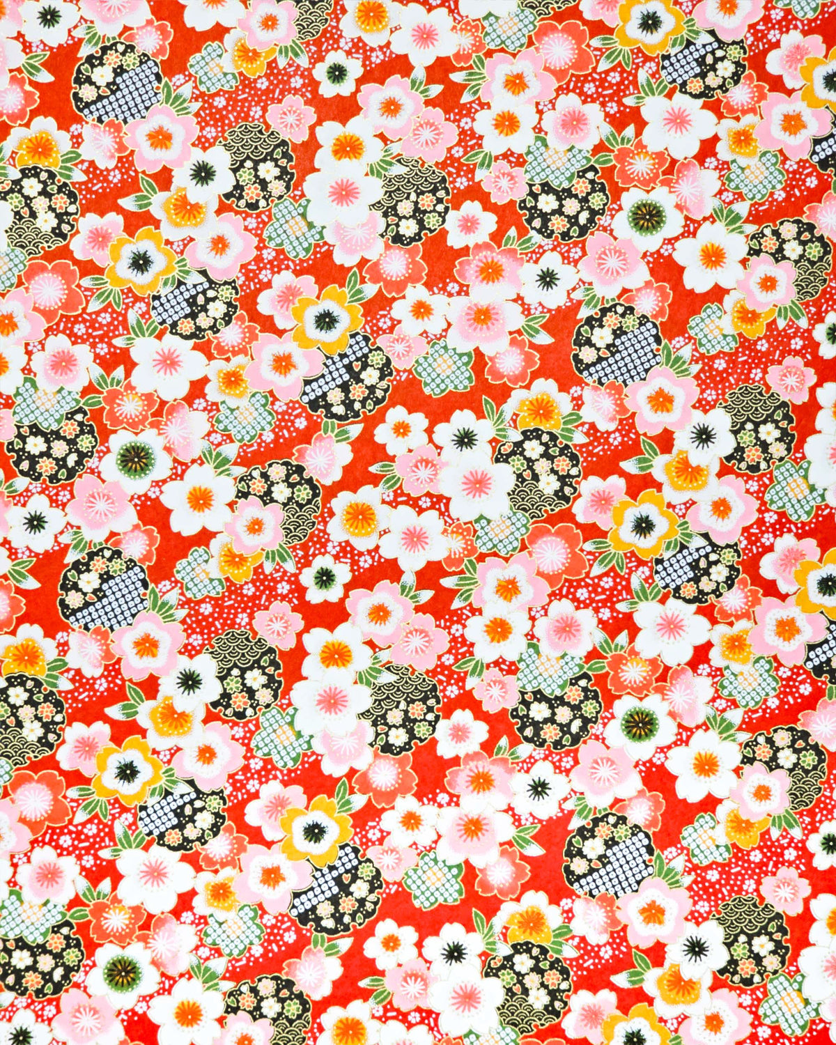 Japanese chiyogami paper featuring pink, white, and orange cherry blossoms with green leaves and black yukiwa (snowflake) on a red background with metallic gold details.