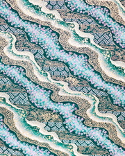 Japanese chiyogami paper featuring pink and white cherry blossoms with assorted traditional Japanese floral and geometric patterns on teal blue background with metallic gold and silver details.