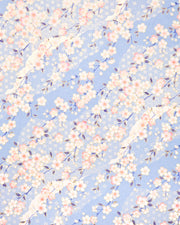 Japanese chiyogami paper featuring pink and white cherry blossoms on a light blue background with asanoha (hemp leaf) and small plum blossom patterns and metallic gold details.
