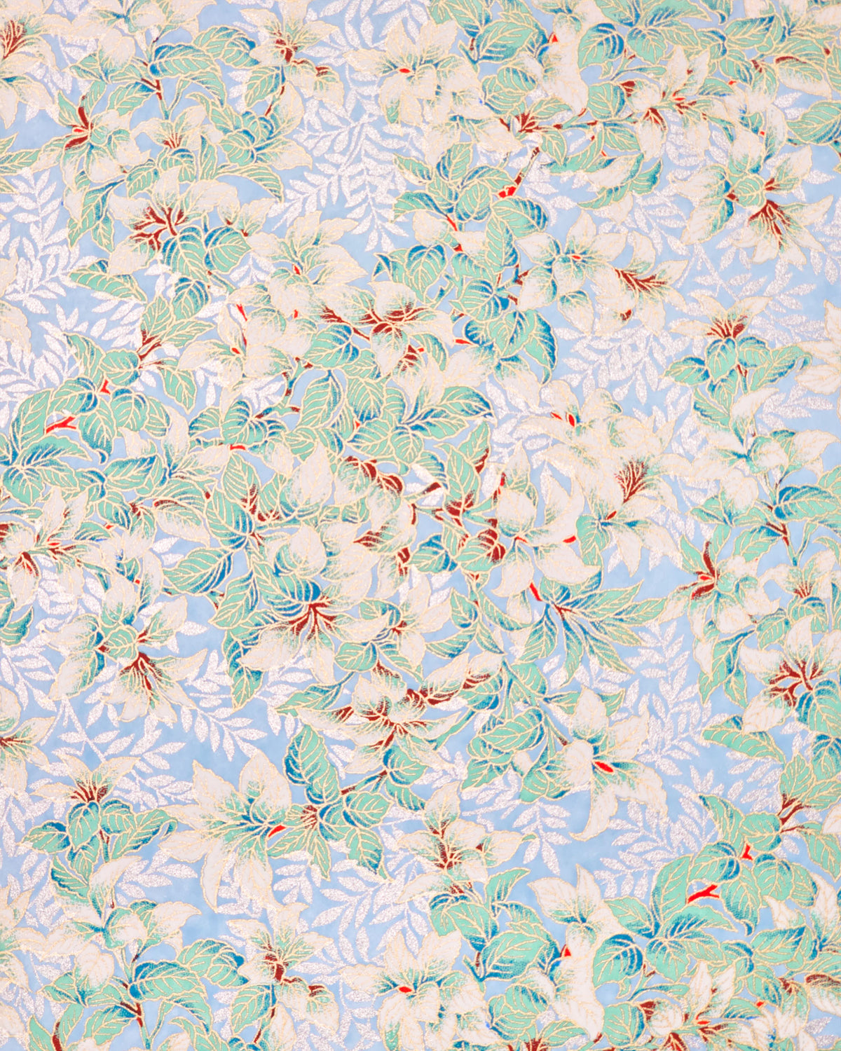 Japanese chiyogami paper featuring green and white leaves with metallic silver leaves on a light blue background with metallic gold details.