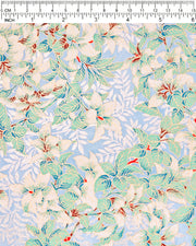 Japanese chiyogami paper featuring green and white leaves with metallic silver leaves on a light blue background with metallic gold details, shown next to a ruler for size reference.