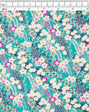 Japanese chiyogami paper featuring cream and magenta pink plum blossoms and cream, magenta pink, and teal wisteria on a teal blue background with metallic gold details, shown next to a ruler for size reference.