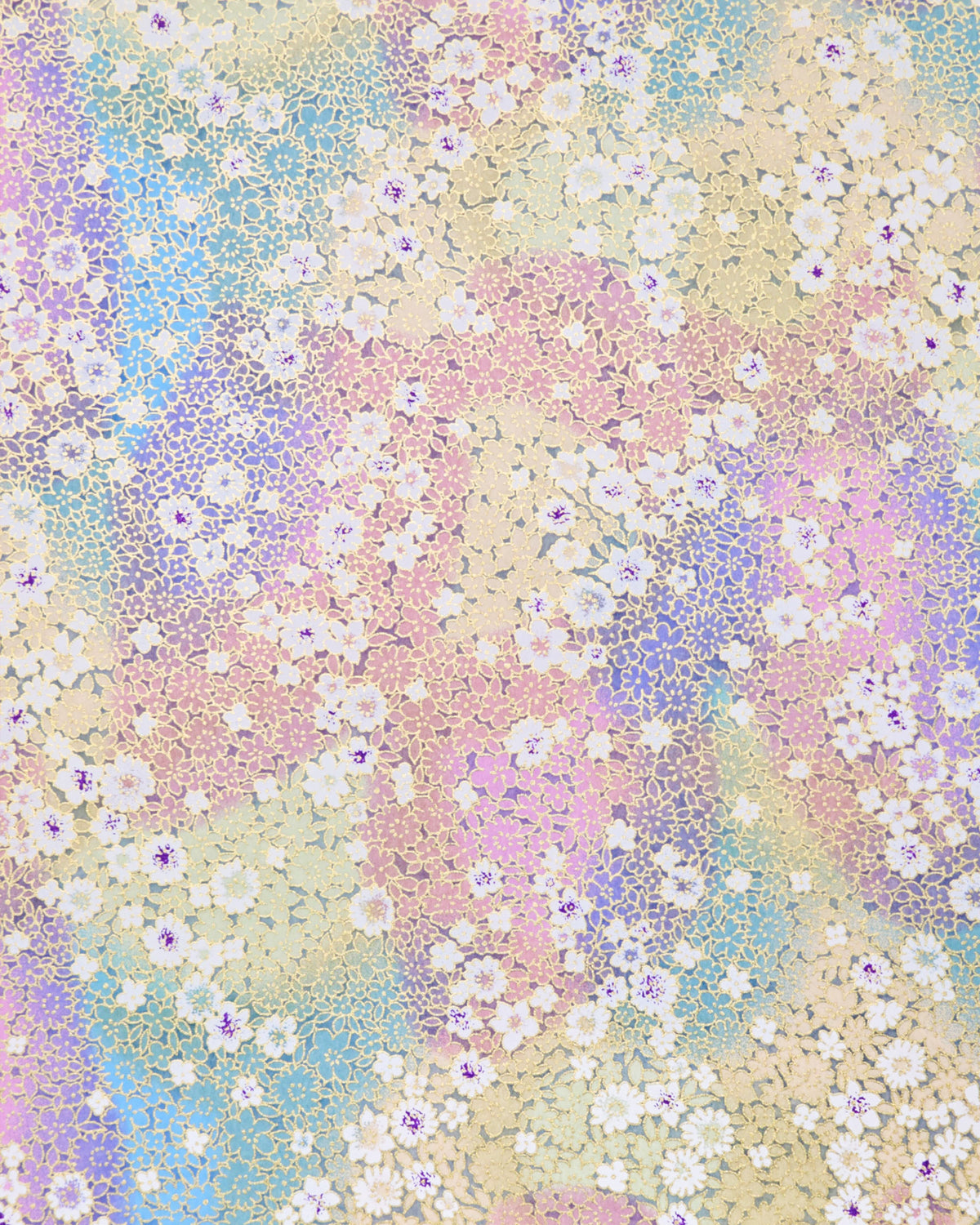Japanese chiyogami paper featuring small white and pastel rainbow-colored flowers with metallic gold details.