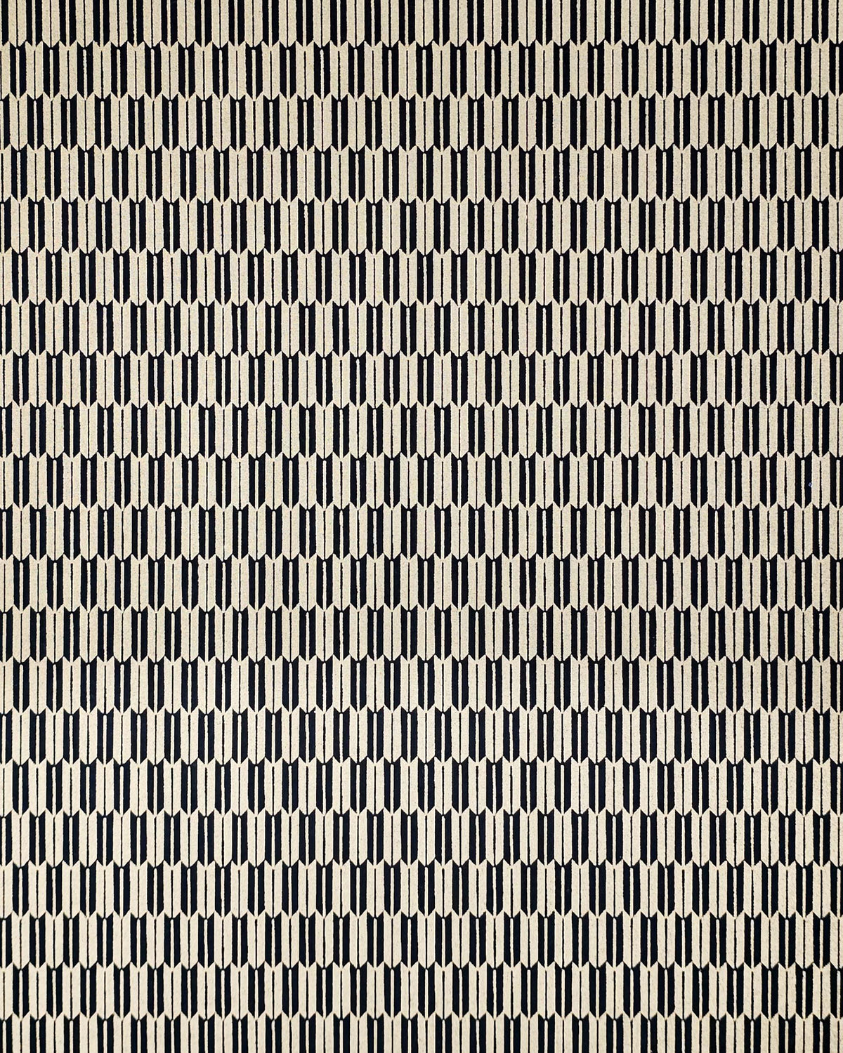Japanese chiyogami paper featuring a traditional black and metallic gold yagasuri (arrow feather) pattern.