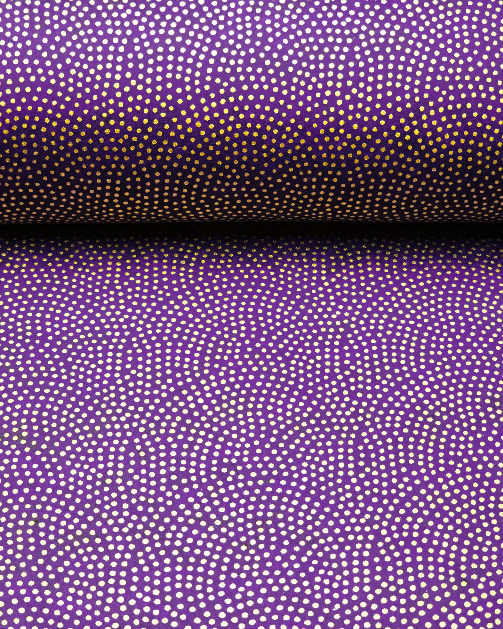 Japanese chiyogami paper featuring a metallic gold "same komon" (sharkskin) design on a dark purple background.